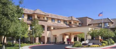Exterior view of Ivy Park at Roseville showing the entrance arch and landscaped grounds.