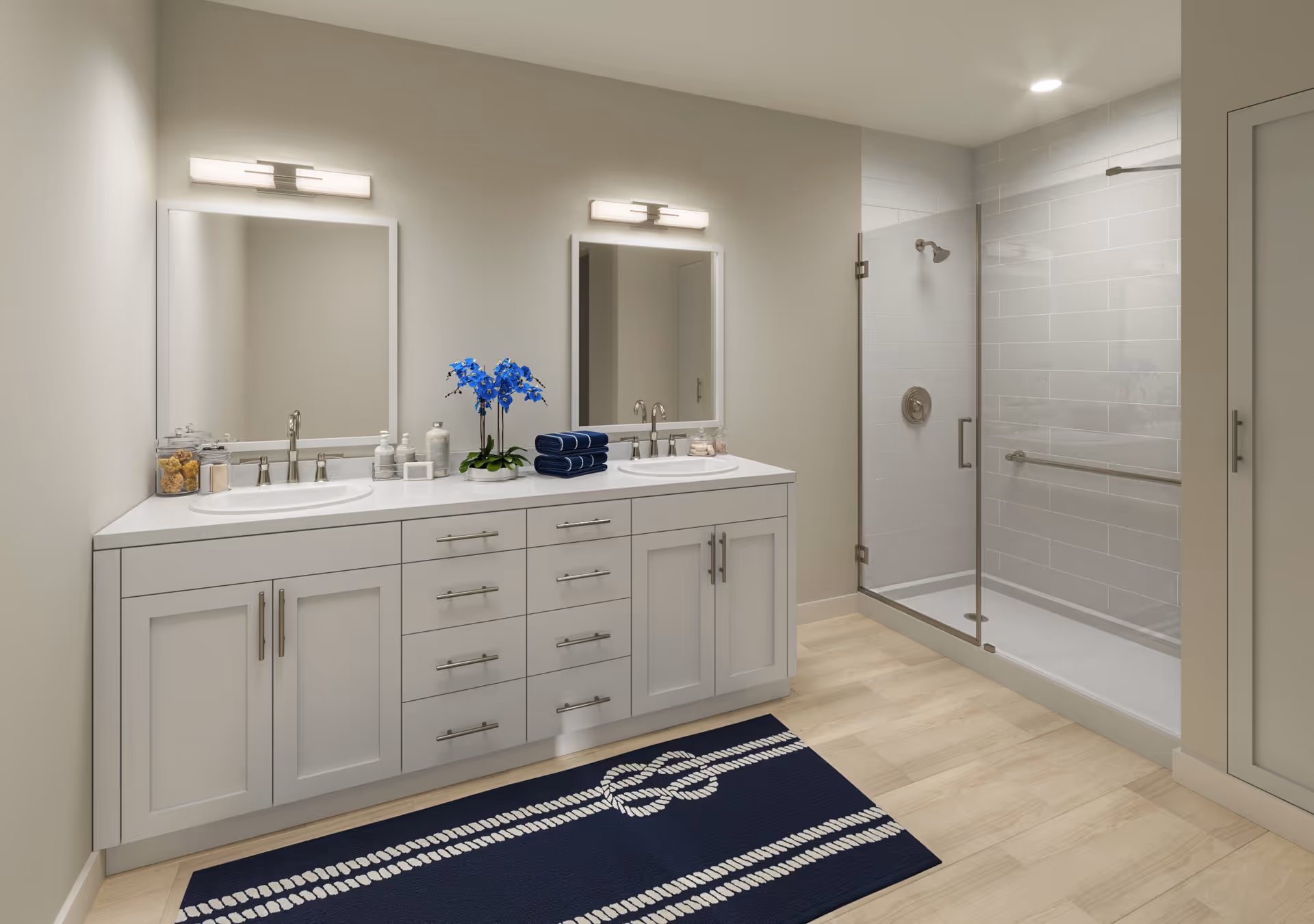 A bright modern bathroom with a double-sink vanity, two mirrors, and a glass-enclosed shower.