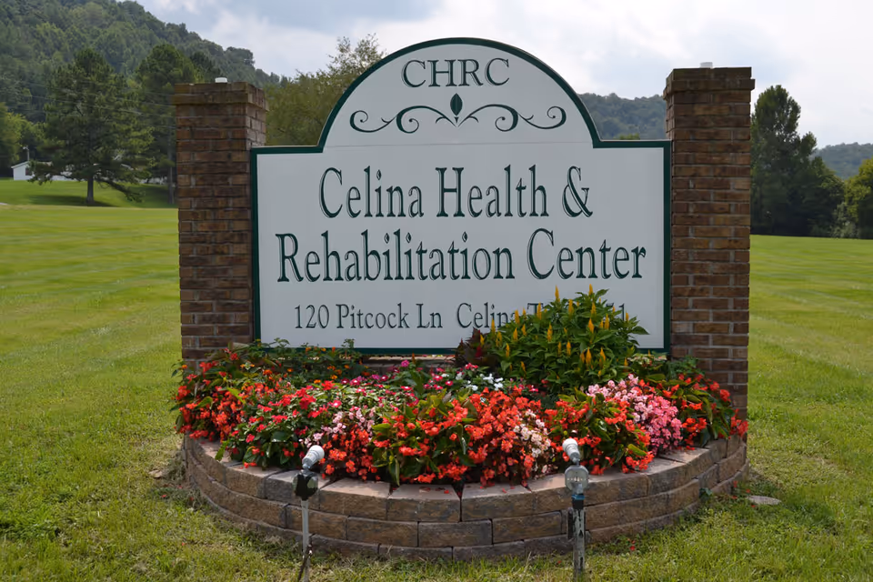 A landscaped entrance sign reading 'Celina Health & Rehabilitation Center' between brick pillars on a grassy lawn.