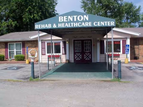 Front view of Benton Rehab & Health Care Center with covered entrance and sign.