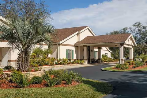 Exterior view of Life Care Center of Hilliard with a covered entrance and landscaped grounds.
