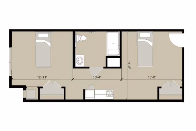 Architectural floor plan showing a layout with two bedrooms, a bathroom with a toilet, sink, and bathtub, and a small kitchen area with a sink.