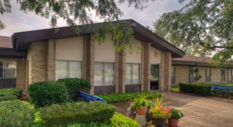 Exterior view of Allendale Nursing and Rehabilitation Community building with entrance and landscaped grounds.
