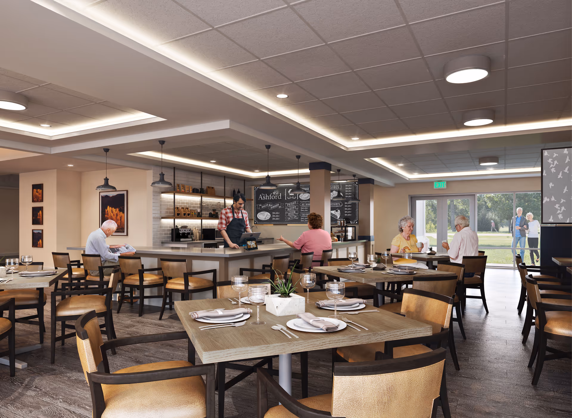 A bright senior living dining room with tables set for meals, a central service counter where a staff member works, and residents seated at tables.