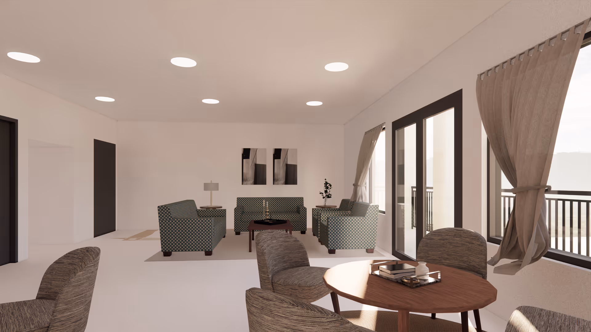 A bright and spacious living room with multiple seating areas including patterned armchairs and sofas arranged around a coffee table. There is a round wooden table with chairs near large windows with beige curtains, allowing natural light to fill the room. The walls are white with minimalistic artwork, and the ceiling has recessed lighting.