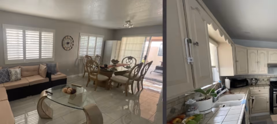 Bright common area featuring a sofa, dining set, and a kitchen in a senior living residence.