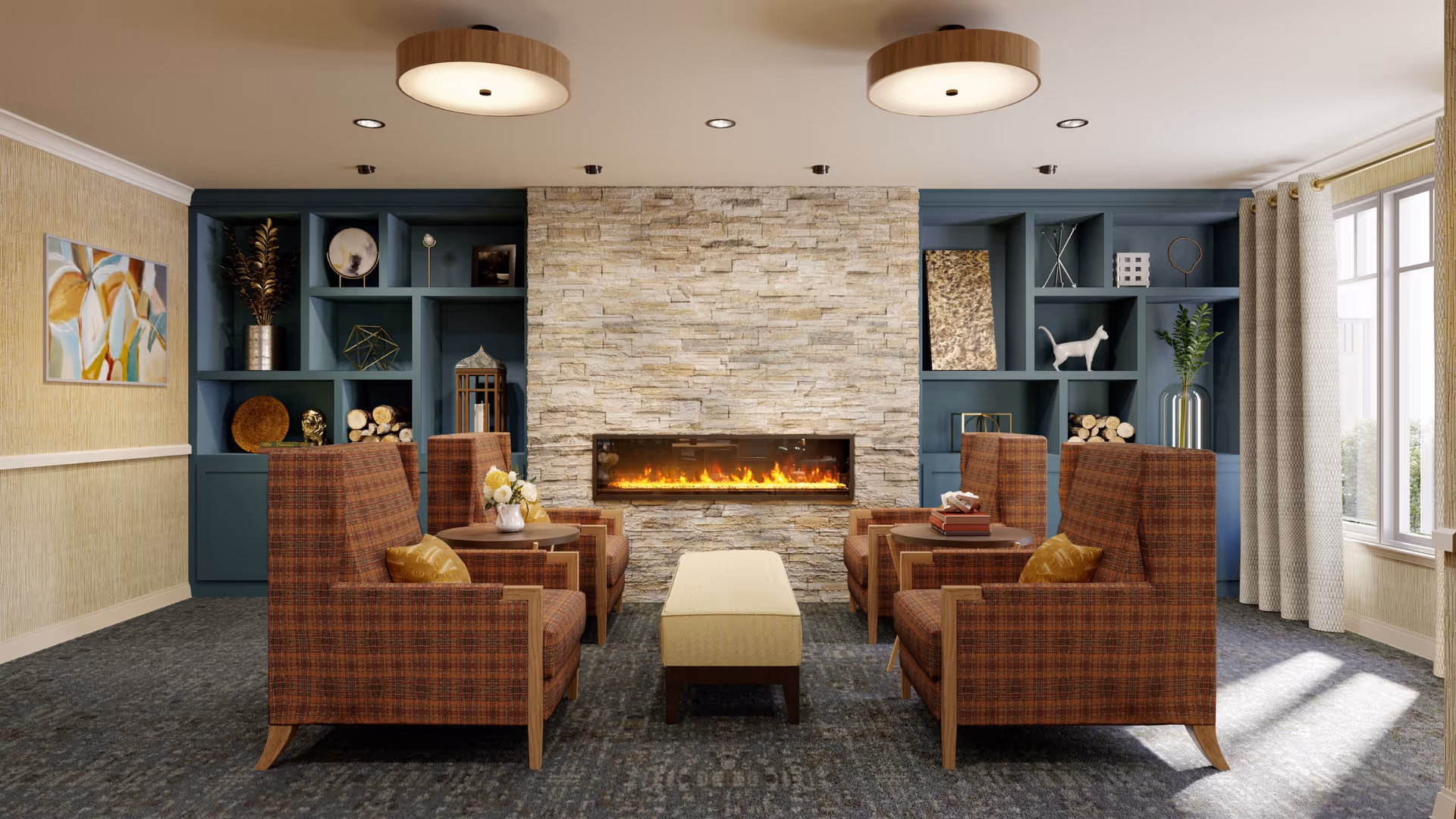 A cozy living room with four brown plaid armchairs arranged around a rectangular ottoman in front of a modern stone fireplace with a glowing fire. The room features built-in blue shelves decorated with various ornaments, a large window with beige curtains letting in natural light, and two round ceiling lights.