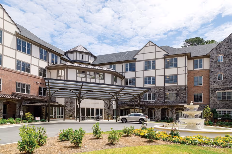 Exterior view of The Terraces at Peachtree Hills Place with fountain entrance.