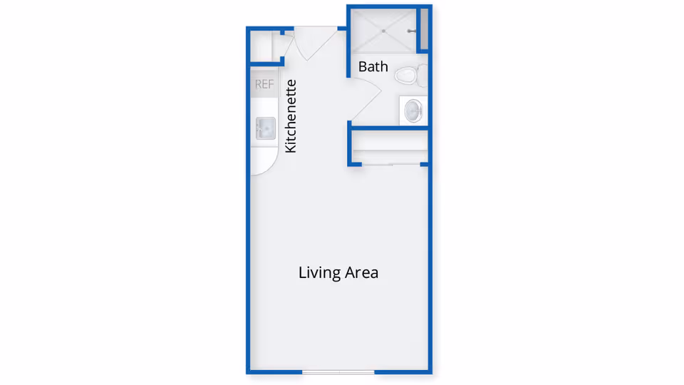 Floor plan of a small living space at Greenwich Farms at Warwick showing a kitchenette, a living area, and a bathroom with a shower, toilet, and sink.