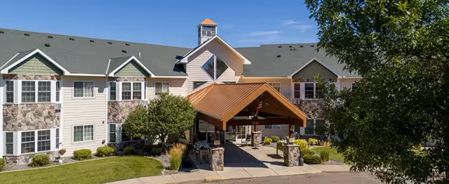 Exterior view of Prairie View Senior Living with a covered entrance and landscaped grounds