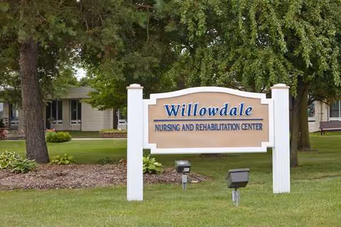 Willowdale Nursing and Rehabilitation Center sign on a grassy, tree-lined exterior.