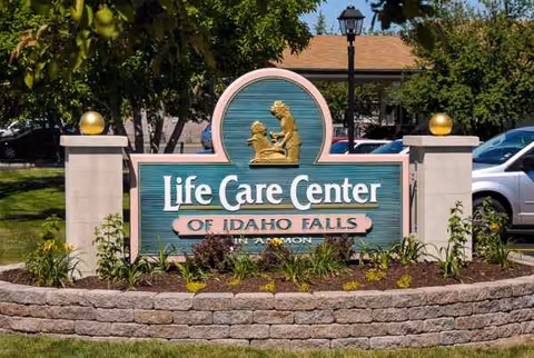 Exterior view of Life Care Center of Idaho Falls sign with landscaped entry