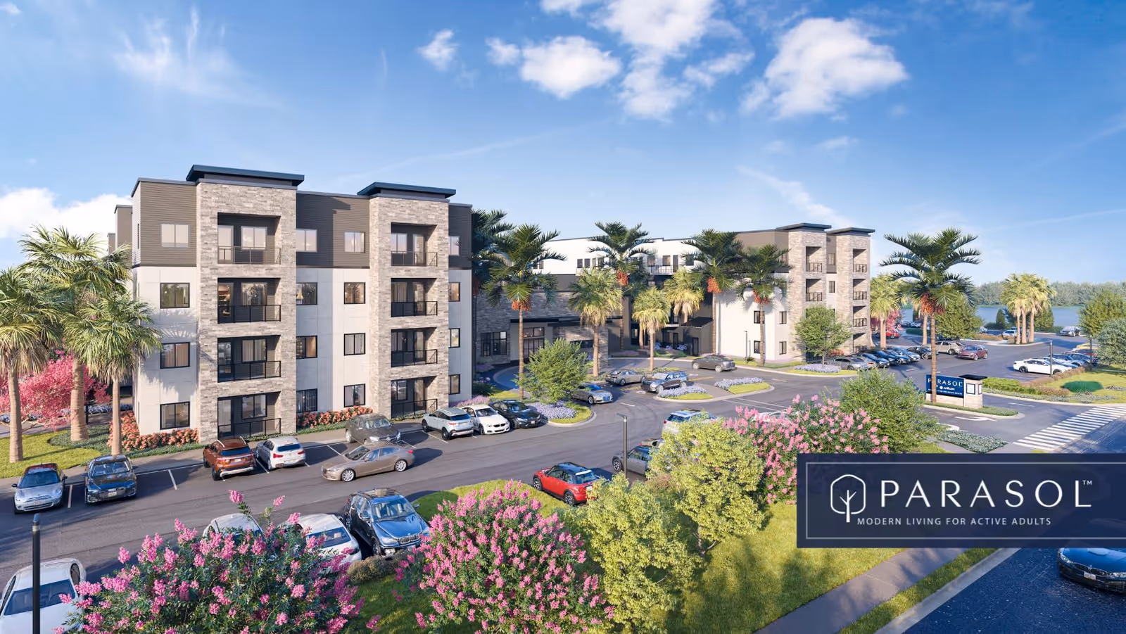 Exterior view of a modern multi-story residential building surrounded by palm trees, landscaped gardens, and a parking lot with several cars. The sky is clear with some clouds, and there is a sign in front of the building that reads 'PARASOL Modern Living for Active Adults.'