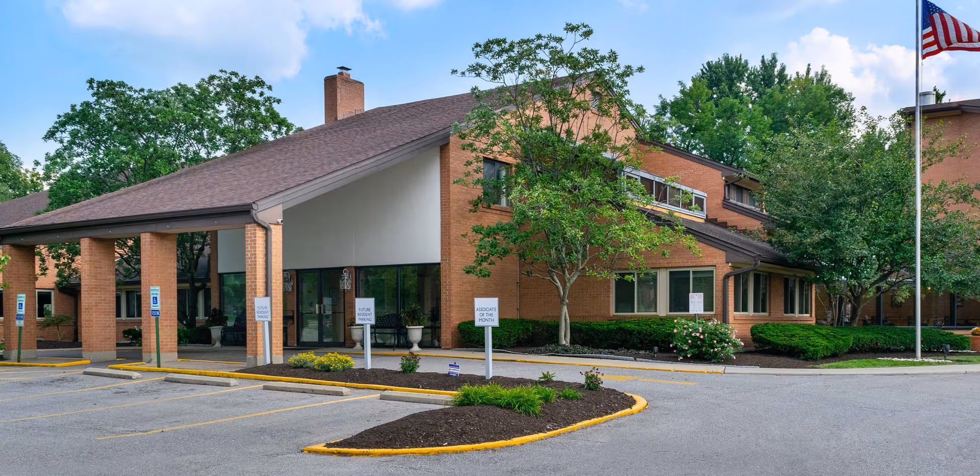 Exterior view of the Deer Park Assisted Living facility with landscaped surroundings.