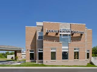 Exterior view of Lorien Health Systems senior living facility building.