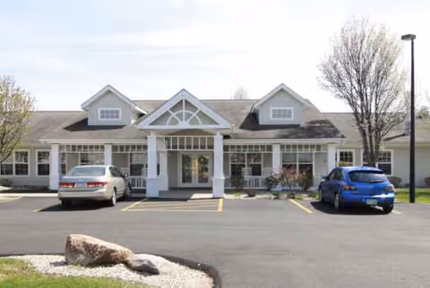 Front view of Campbell Place entrance with parked cars.