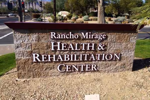 Stone sign for Rancho Mirage Health and Rehabilitation Center at the facility entrance.