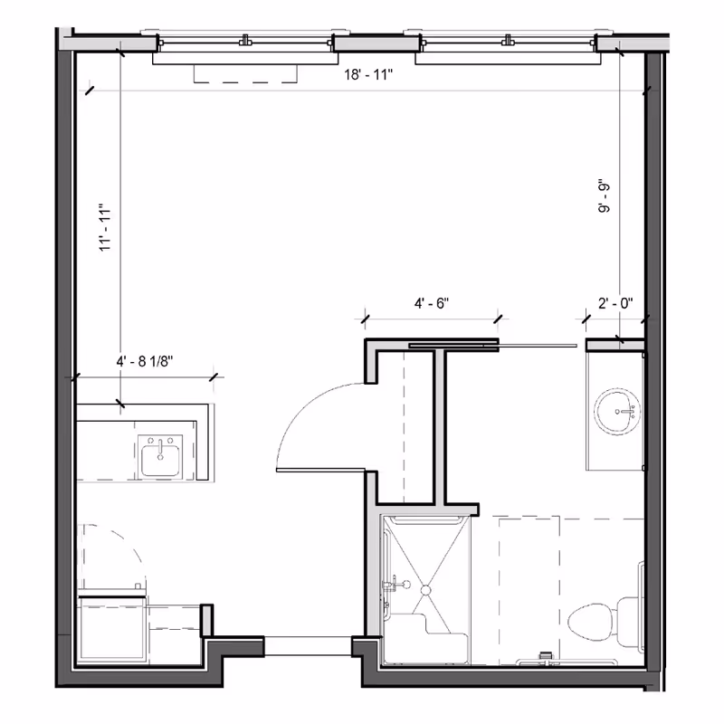 Floor plan of a small studio unit showing a main living area, kitchenette, entry door, and a bathroom with shower, sink, and toilet.