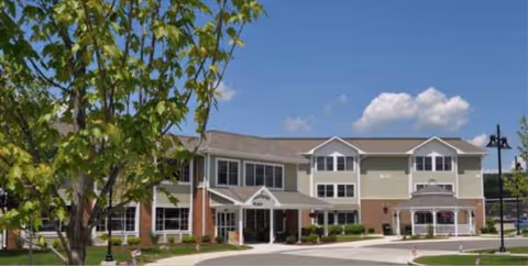 Exterior view of Bergquist Adult Home, a two-story senior living building with entrance.