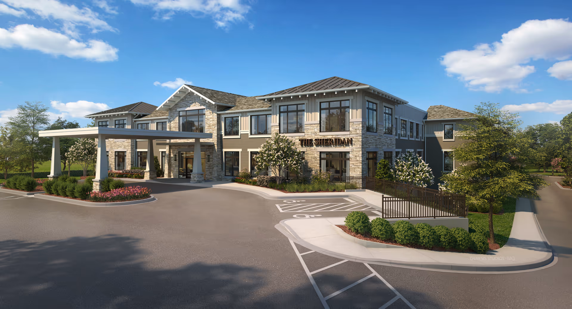 Front exterior of The Sheridan at Severna Park senior living building with a covered entrance, landscaping, and parking area under a blue sky.