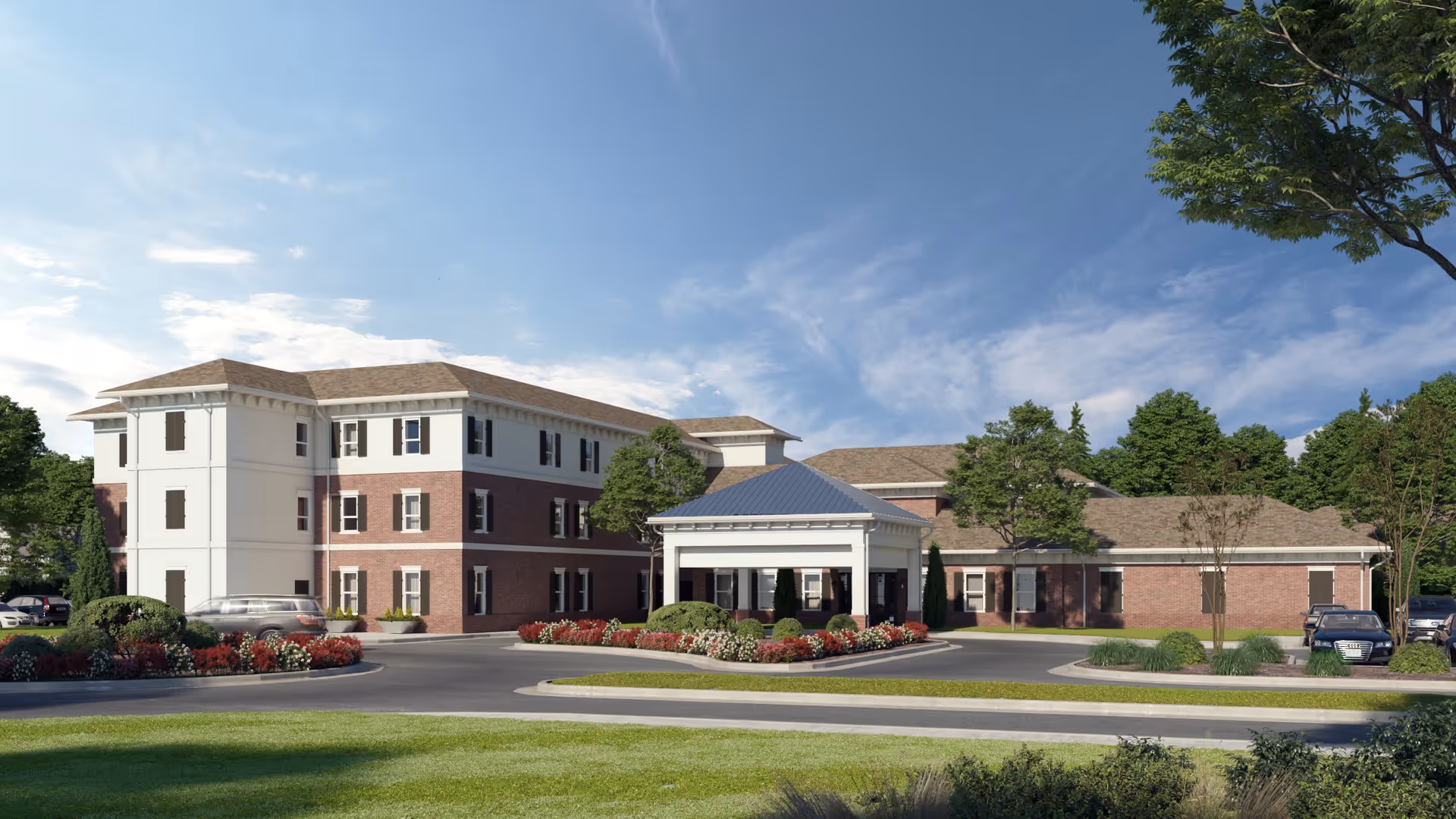 Exterior view of The Landing of Bogart senior living facility showing a three-story building with a covered entrance, surrounded by landscaped gardens, trees, and parked cars under a blue sky.