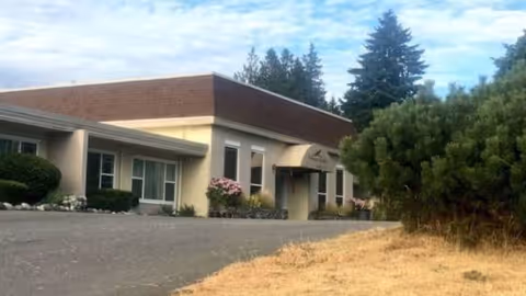 Front exterior view of Olympic View Assisted Living with entrance and landscaping.