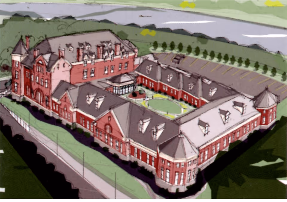 Aerial illustration of a large, red-brick senior living facility named The Victorian at Riverside, featuring multiple connected buildings with pitched roofs, dormer windows, a central courtyard with greenery, and a surrounding parking lot.