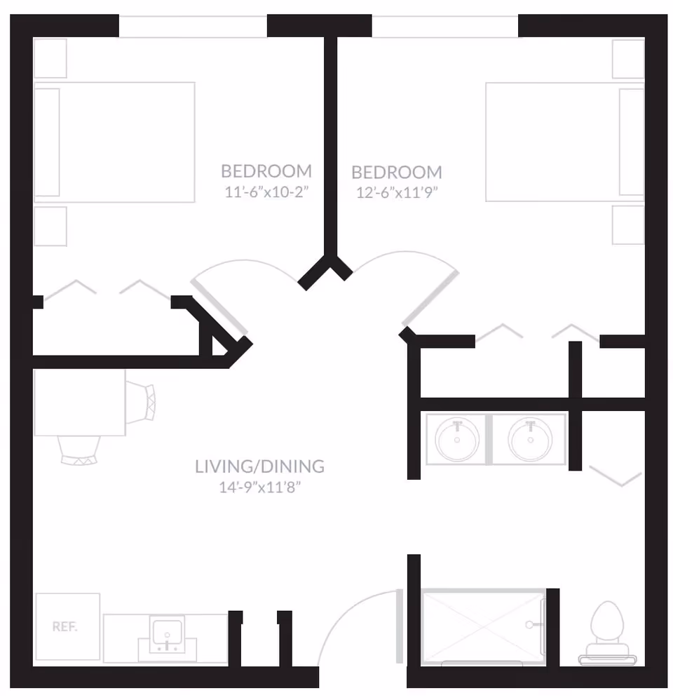 Floor plan of a residential unit at Laurel Glen at Sugar Land showing two bedrooms, a combined living and dining area, a kitchen area with a refrigerator and sink, and a bathroom with a shower, toilet, and double sink.