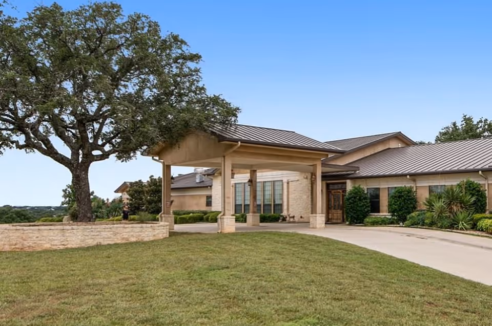 Front entrance with porte-cochère and landscaped grounds at Arbor House.