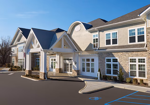 Front entrance of The Bristal Assisted Living at Lake Success building with porte-cochere