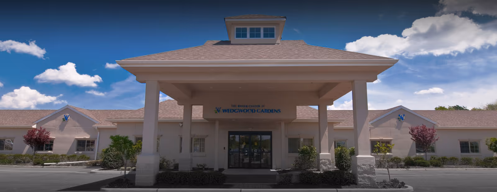 Exterior view of The Rehab Center at Wedgwood Gardens entrance.