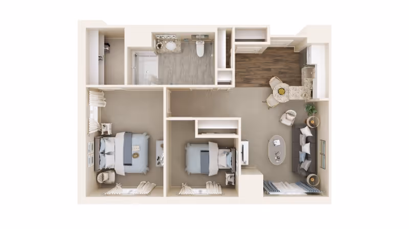 Top-down view of a two-bedroom apartment floor plan featuring a living room with a sofa, coffee table, and chairs, a kitchen area with a dining counter and two chairs, a bathroom with a shower, sink, and toilet, and two bedrooms each with a bed and bedside tables.