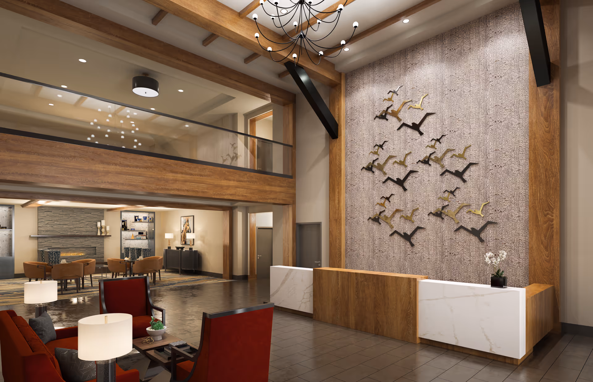 Modern double-height lobby with a reception desk, bird wall sculpture, seating area and mezzanine overlooking the space.