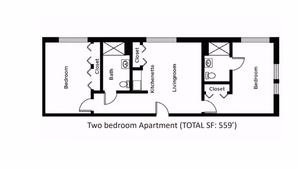 Floor plan of a two-bedroom apartment with a total area of 559 square feet. The layout includes two bedrooms, two bathrooms, a kitchenette, a living room, and closets in each bedroom and near the kitchenette.