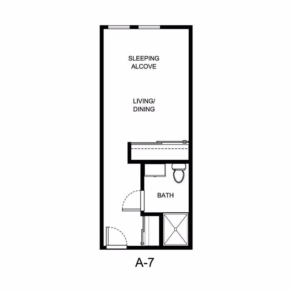 Floor plan labeled A-7 showing a layout with a sleeping alcove, living/dining area, and a bathroom including a toilet and shower.