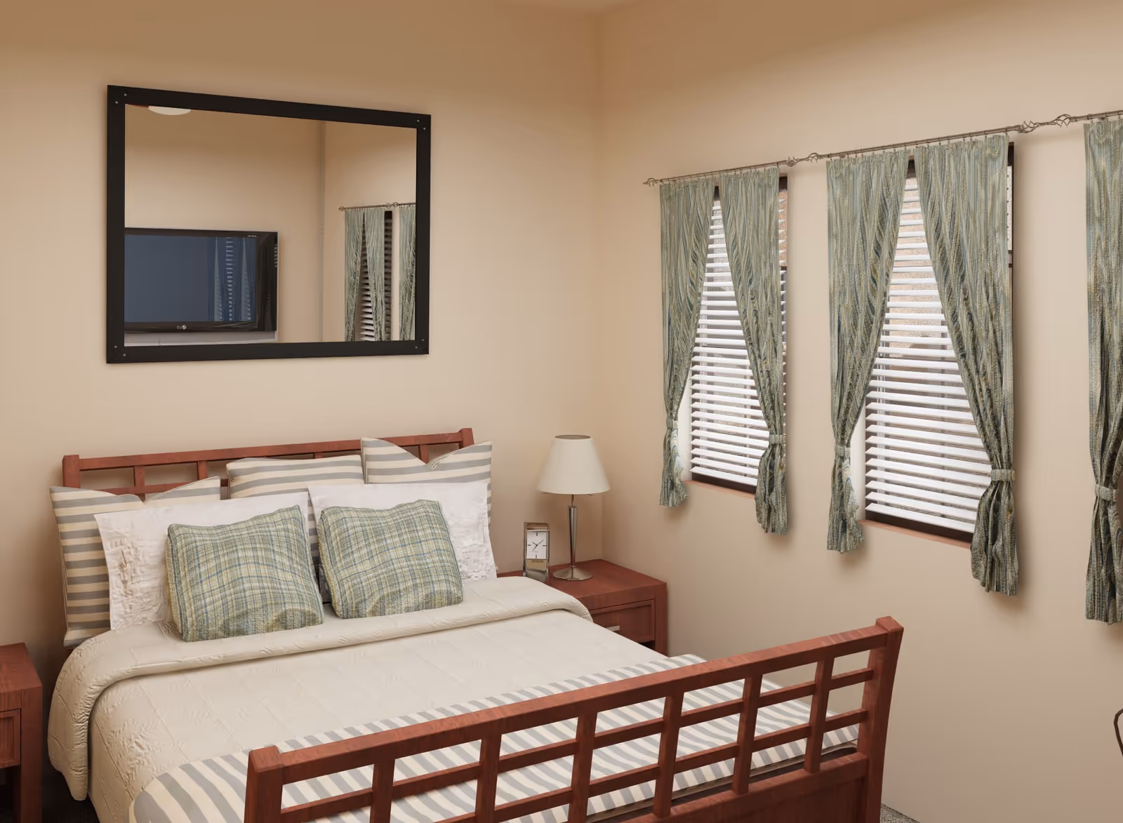 A cozy bedroom with a wooden bed frame, neatly made bed with striped and plaid pillows, a bedside table with a lamp and a clock, three windows with greenish curtains and blinds, and a large mirror on the wall reflecting a television.