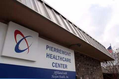 Exterior of Pierremont Healthcare Center with brick facade and sign.