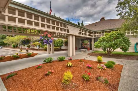 Exterior view of Village Concepts of Gig Harbor Sound Vista Village entrance with landscaped garden