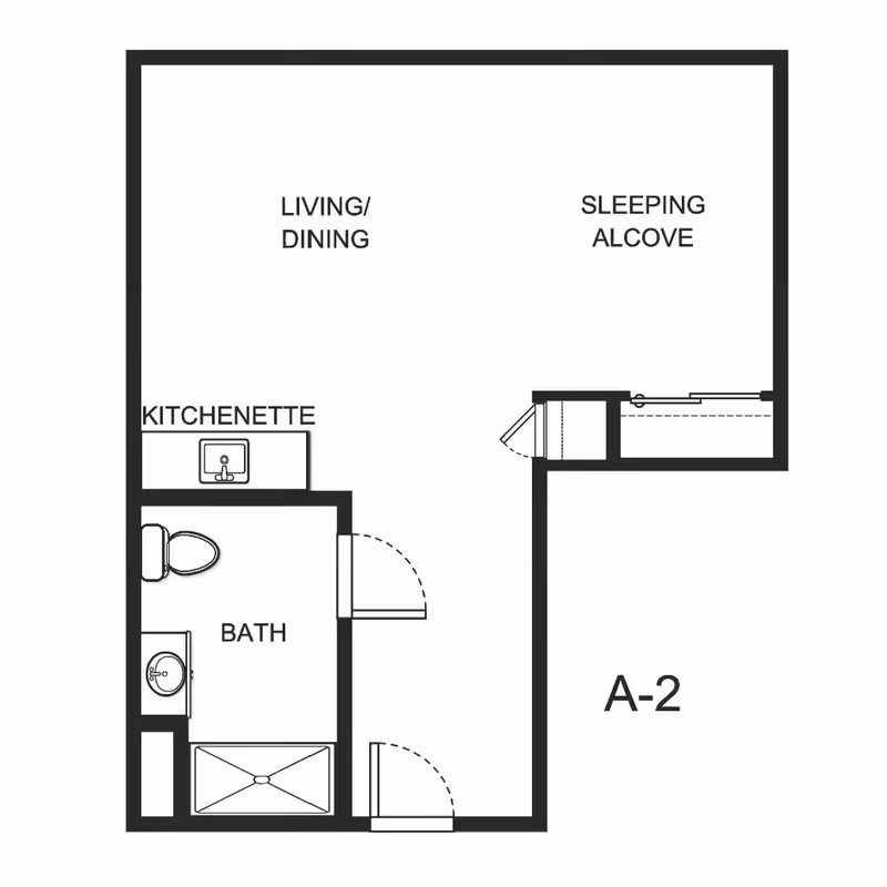 Floor plan of a studio apartment labeled A-2 showing a living/dining area, sleeping alcove, kitchenette, and a bathroom with a toilet, sink, and shower.