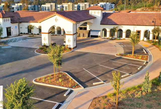 Exterior view of Ridgeview Health Center with curved driveway and parking lot.
