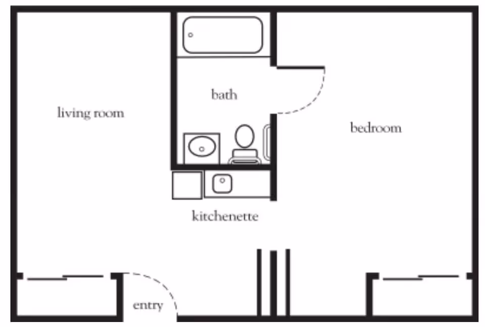 Floor plan layout showing a living room, bedroom, bath with bathtub, toilet, and sink, and a kitchenette area near the entry.