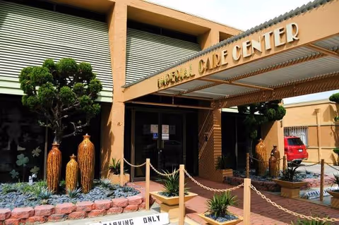Exterior view of Imperial Care Center entrance with landscaping and a covered doorway.