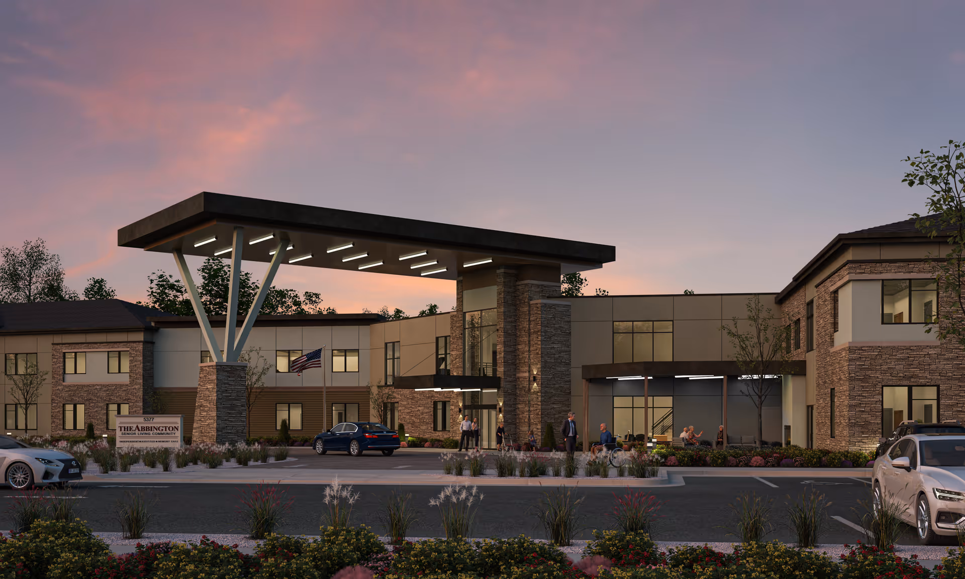 Front entrance of Abbington Senior Living of Layton at dusk showing a covered porte-cochère, parked cars, people, and landscaped grounds.