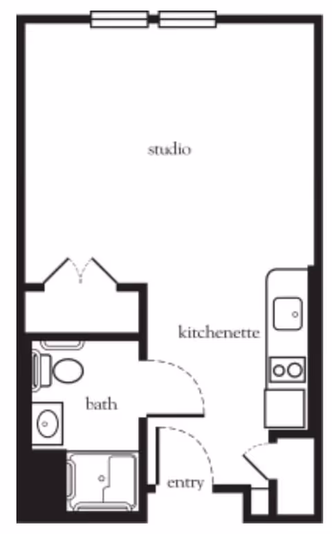 Floor plan of a studio apartment featuring a kitchenette, a bathroom with a toilet, sink, and shower, and an entry area.