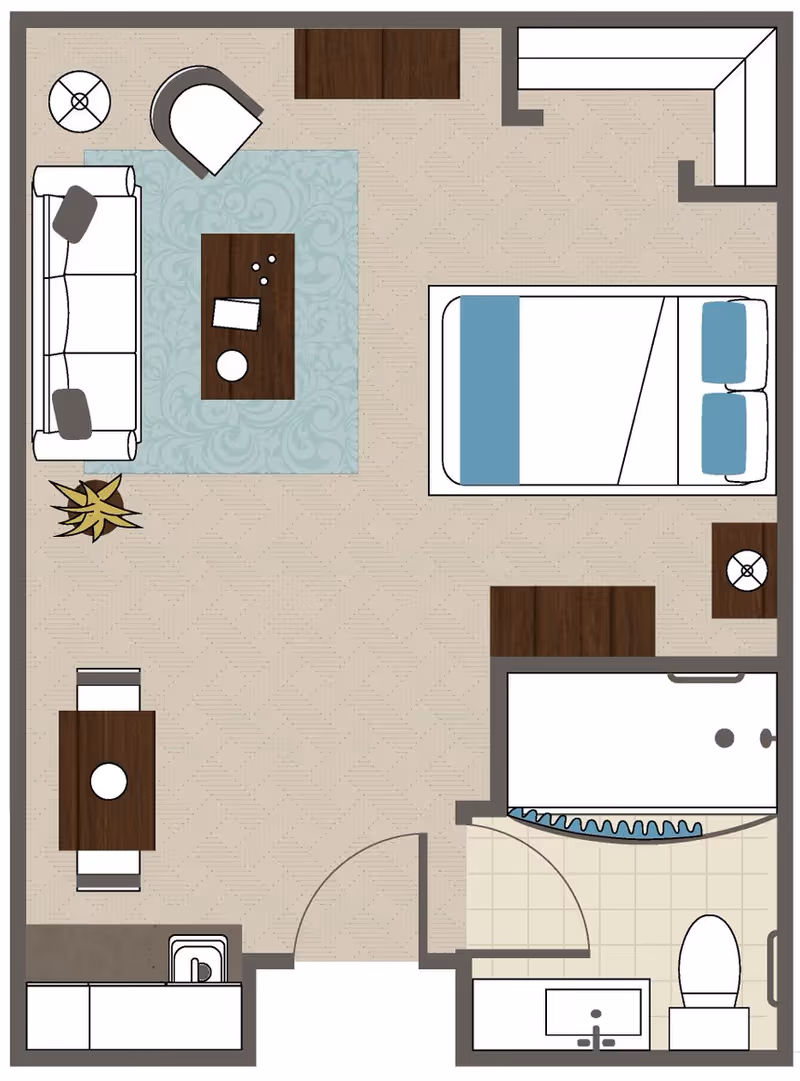 Top-down floor plan of a studio apartment showing a combined living and sleeping area with a sofa, rug, coffee table, bed, small dining table, kitchenette, and a bathroom.