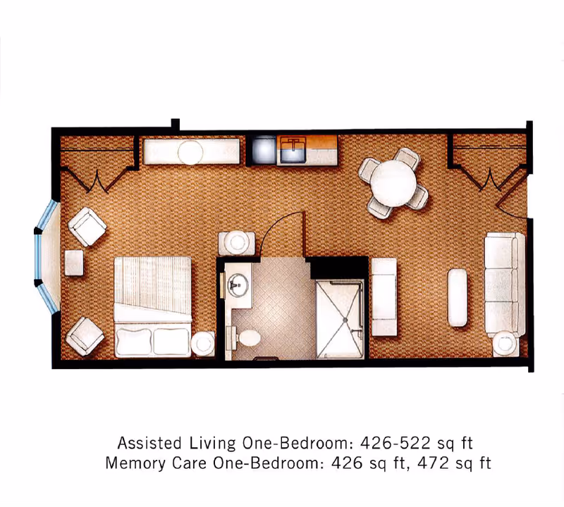 Top-down colored floor plan of a one-bedroom assisted living apartment showing bedroom, bathroom, kitchen, dining and living areas with furniture.