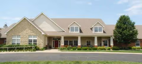 Front exterior of a Brookdale Corsicana senior living facility with entry and landscaping.