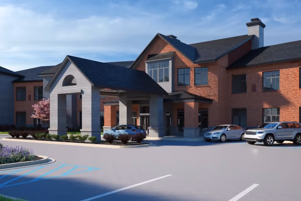 Exterior view of The Barclay at Midlothian: brick building, covered entrance, and front parking.