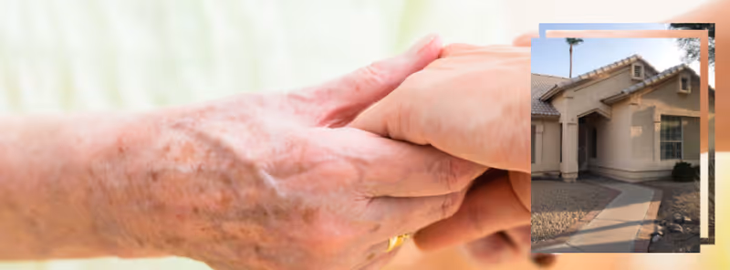 Close-up of two hands gently holding each other, with an inset image of the front exterior of a single-story house with a tiled roof and a walkway leading to the entrance.