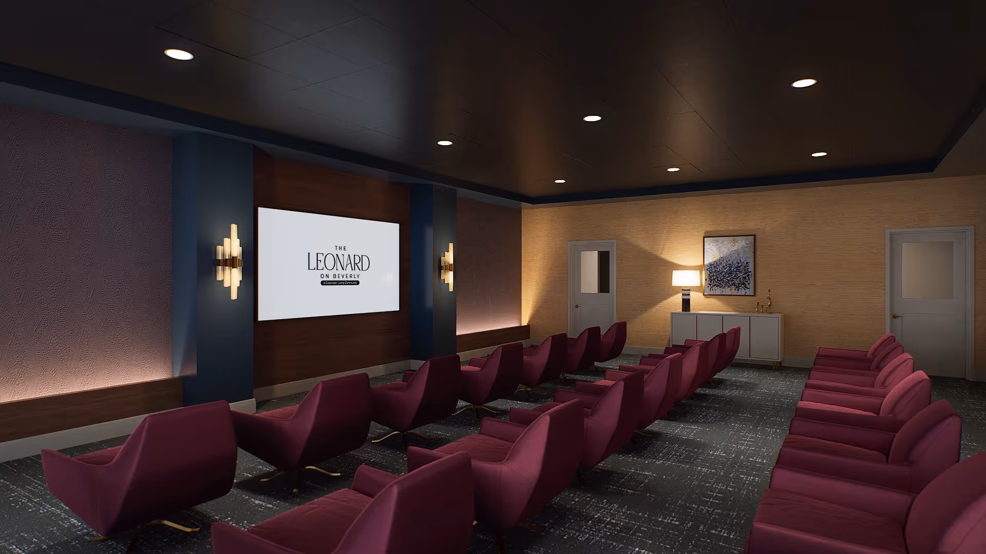 A cozy theater room with two rows of purple upholstered chairs facing a large screen displaying 'The Leonard on Beverly'. The room has dark ceiling with recessed lighting, textured walls in blue and beige tones, wall sconces, a sideboard with a lamp and artwork, and two closed doors.
